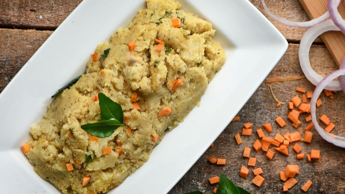 Bowl of savoury porridge topped with herbs