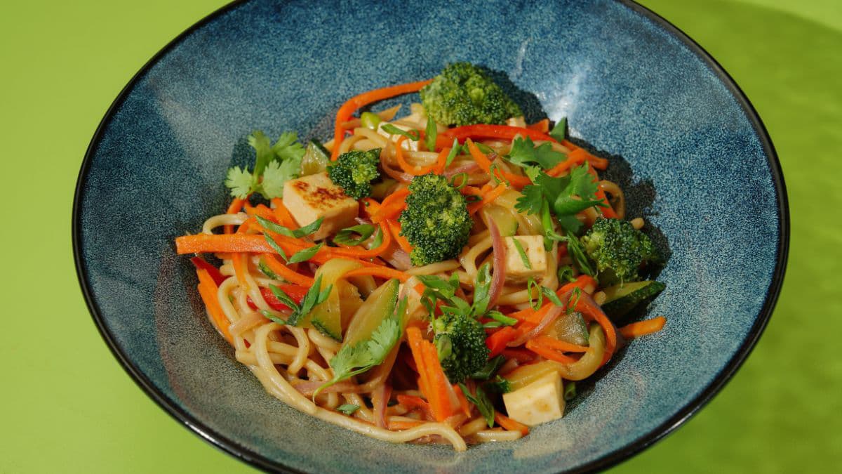 Loaded veggie noodle bowl with tofu and greens 