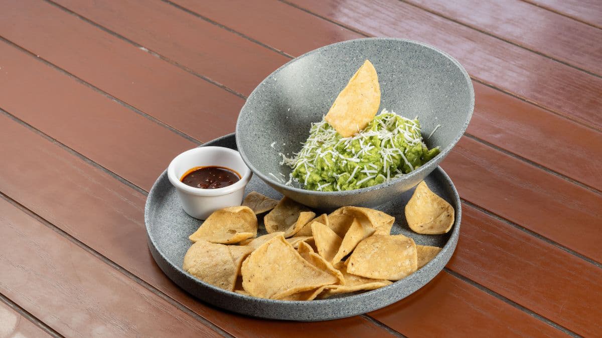 Guacamole served with tortilla chips and snacks