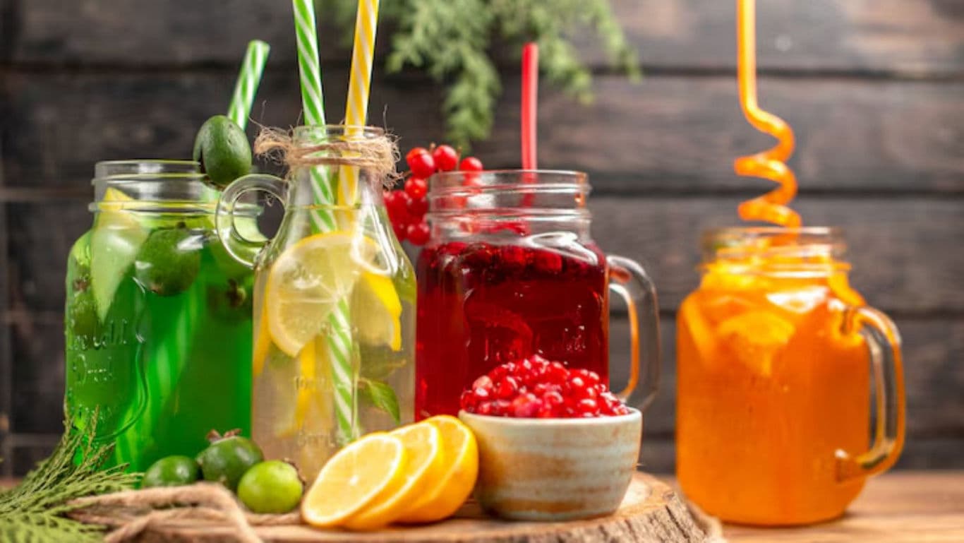 Colorful fruit drinks in mason jars