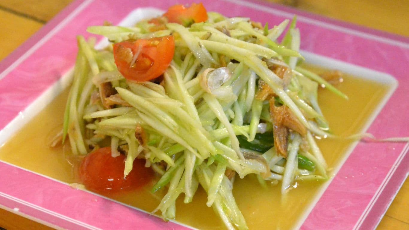 Fresh Thai green papaya salad with tomatoes