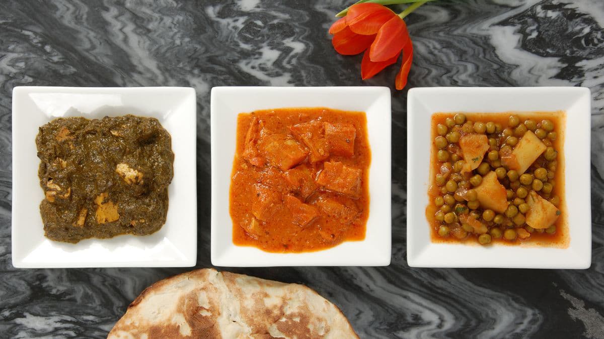 Indian curry dishes in a row