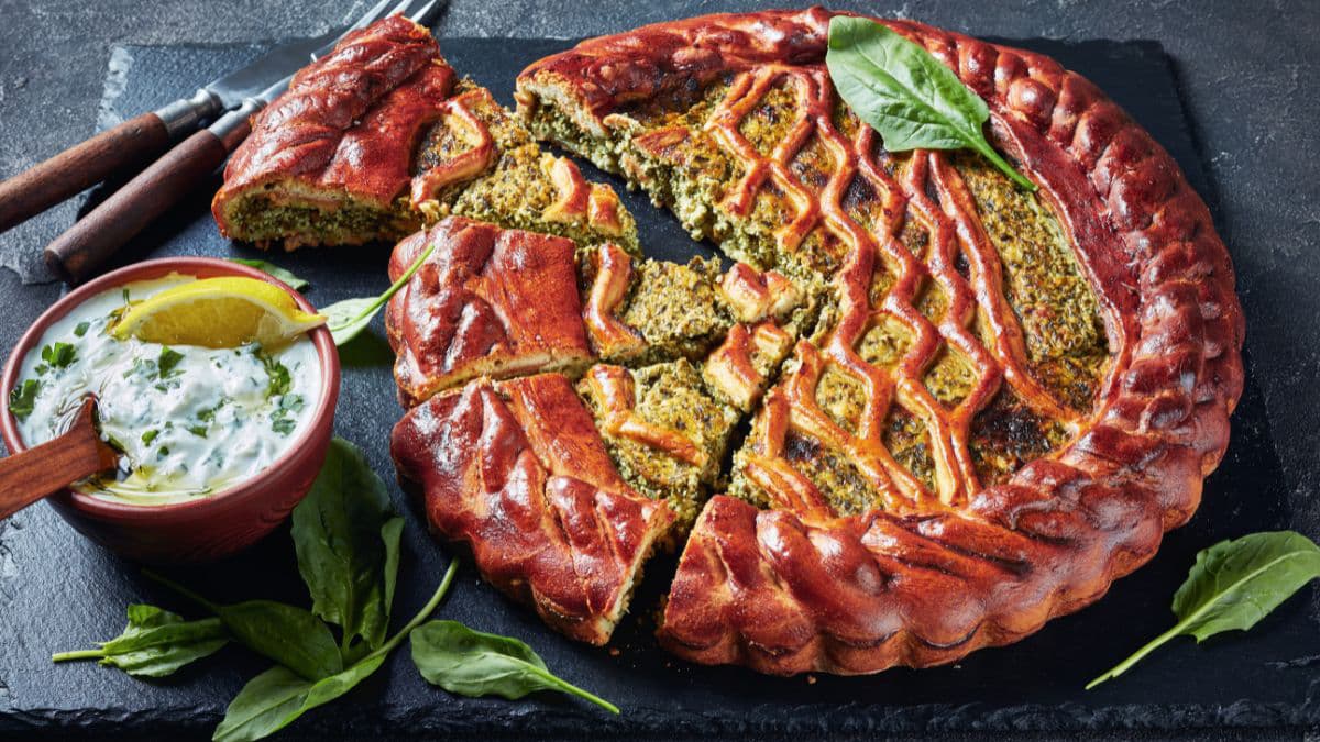 Spinach and ricotta pie being sliced
