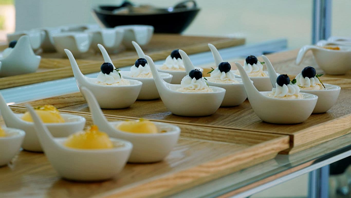 Elegant Dessert Spoons with Cream and Blueberries