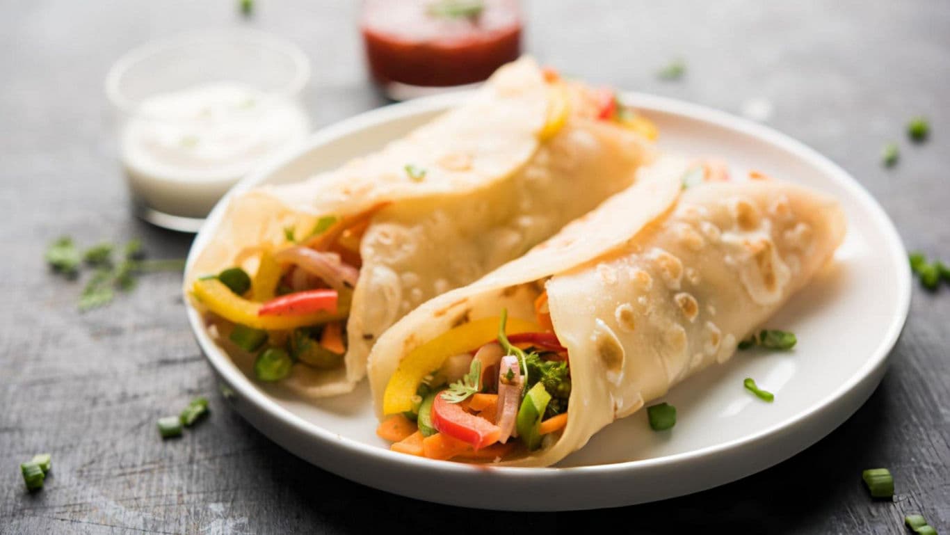 Vegetable wraps served on white plate
