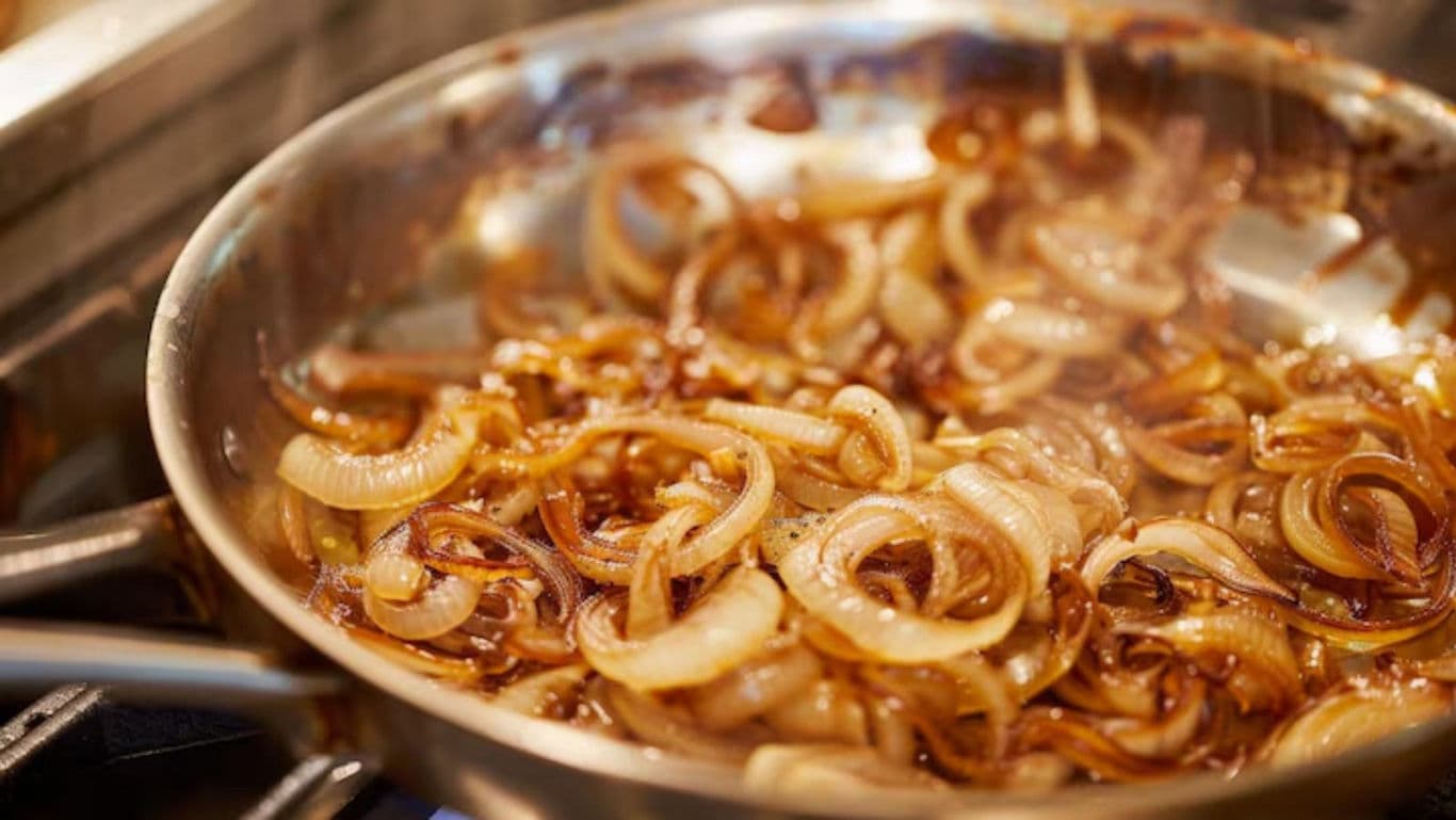 Caramelized onions cooking in a skillet
