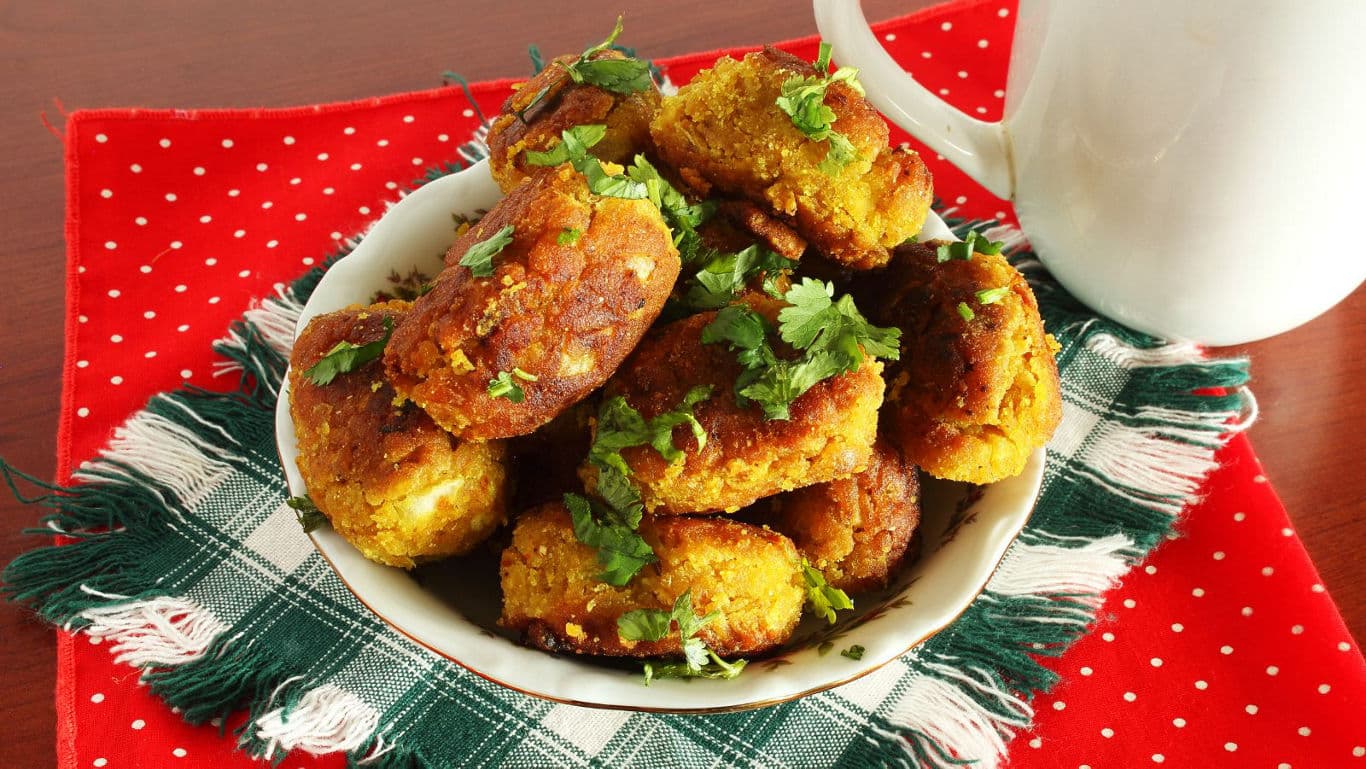 Plate of fried vegetarian croquettes with herbs