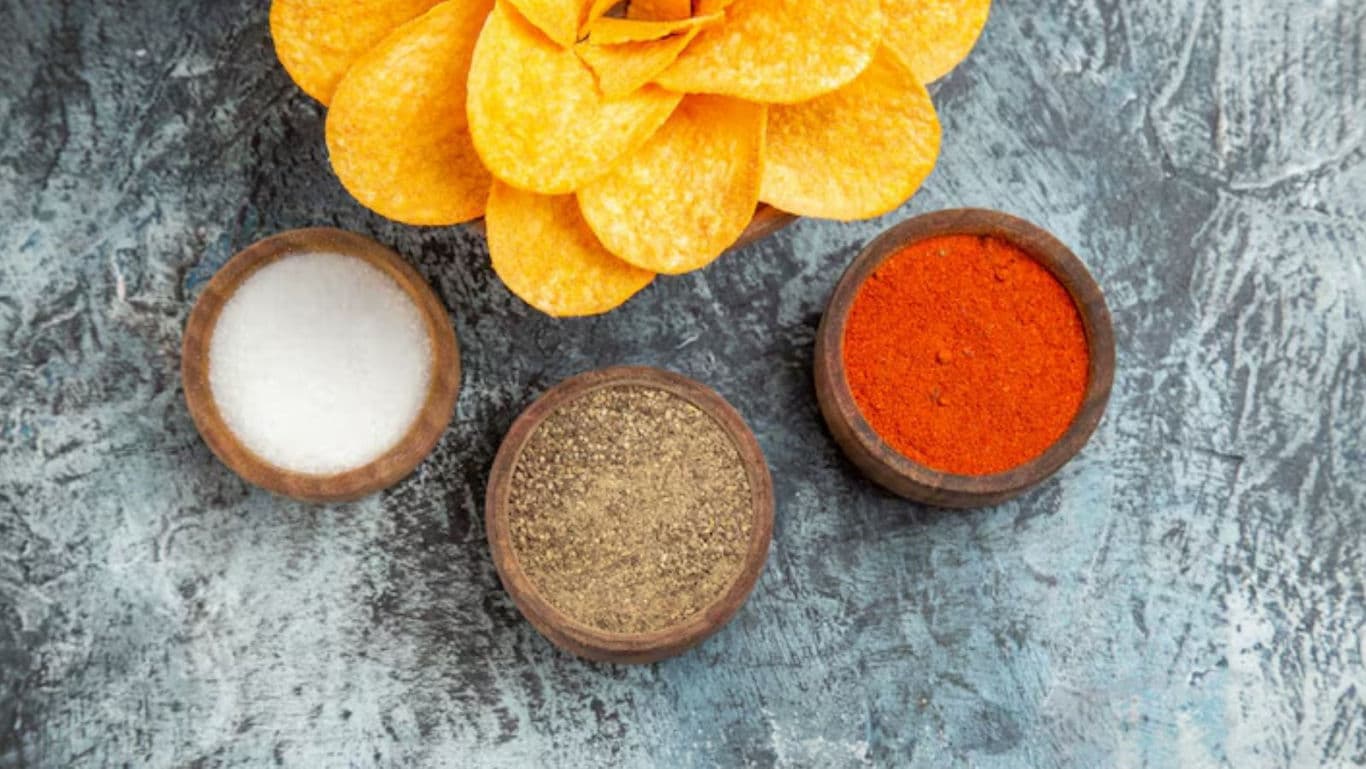 Assorted Spices and Chips on Rustic Surface