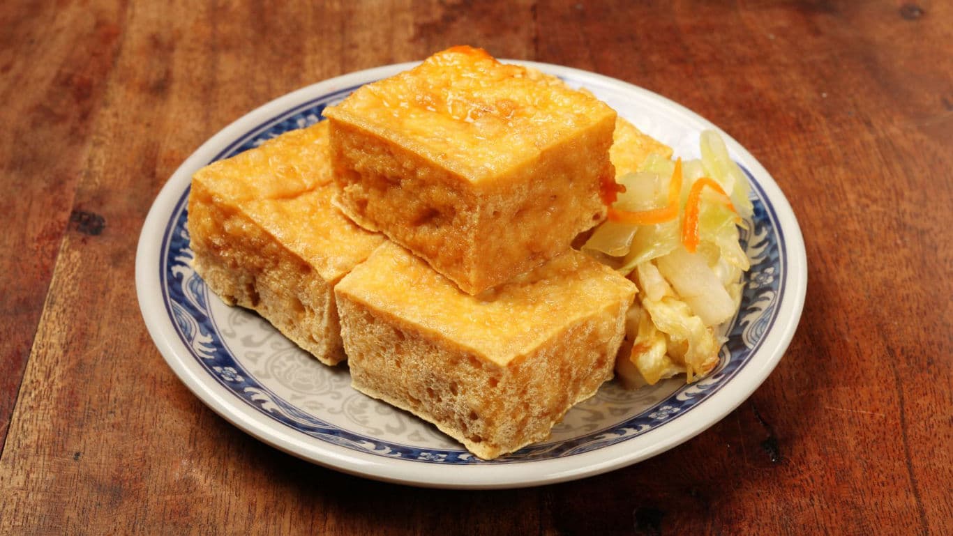 Crispy fried tofu cubes with pickled vegetables