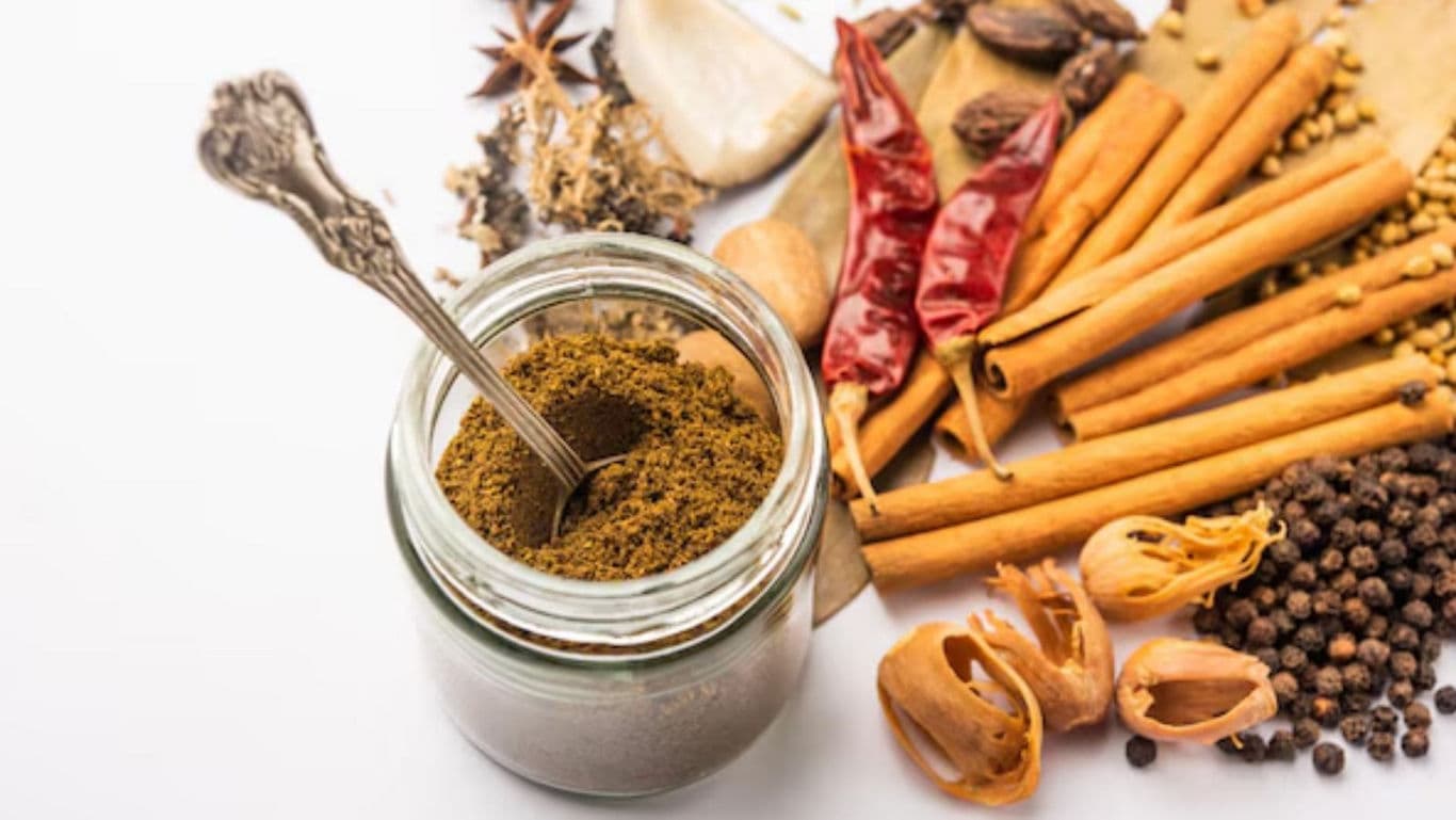 Jar of spice blend with whole spices