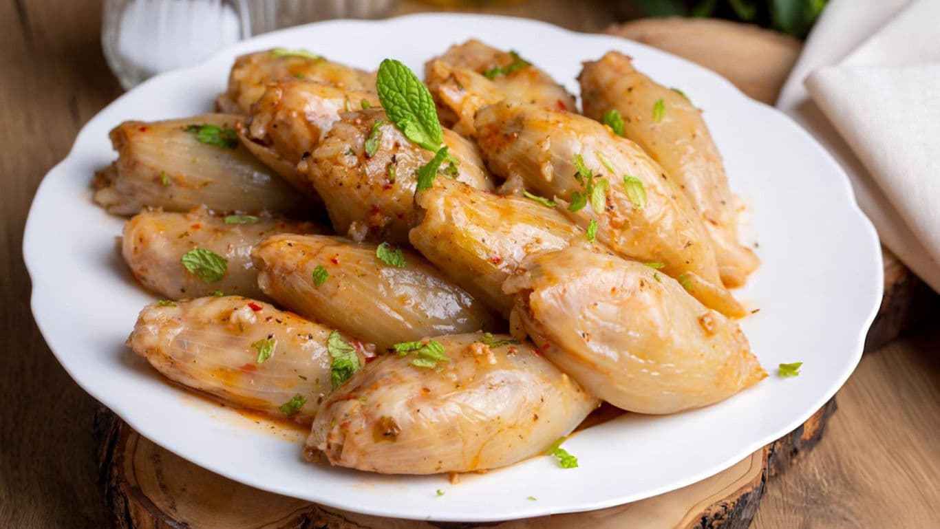 Stuffed cabbage rolls served on white plate