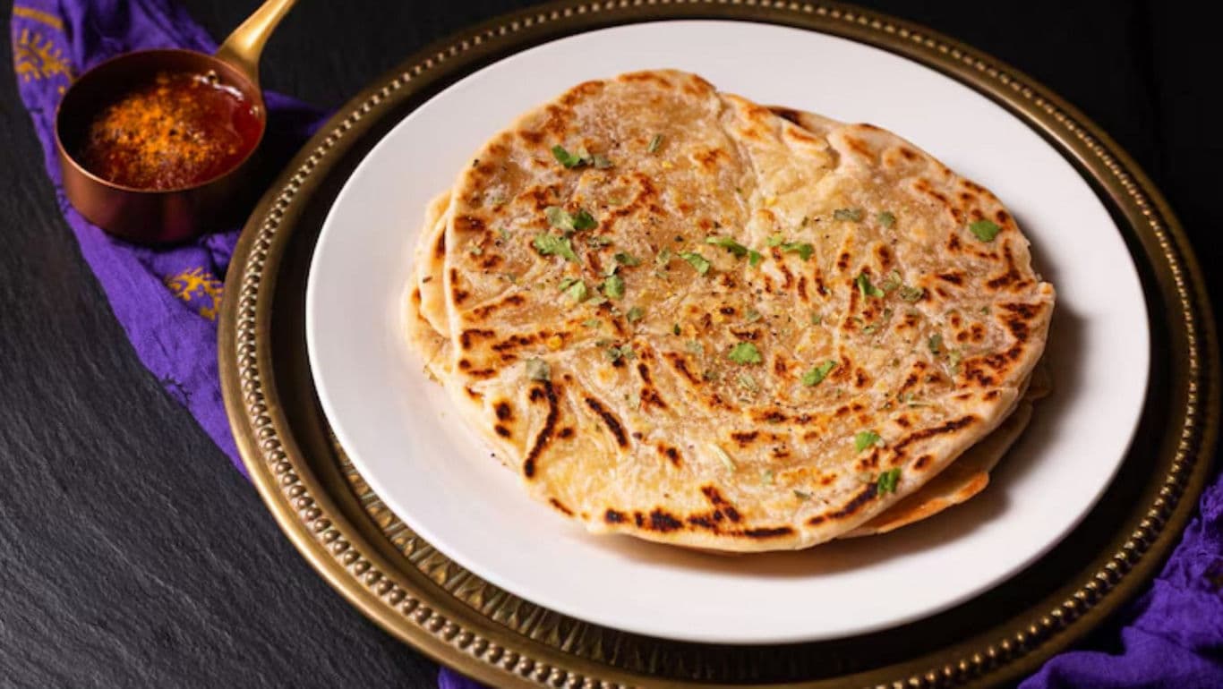 Stuffed flatbread with garnish on plate