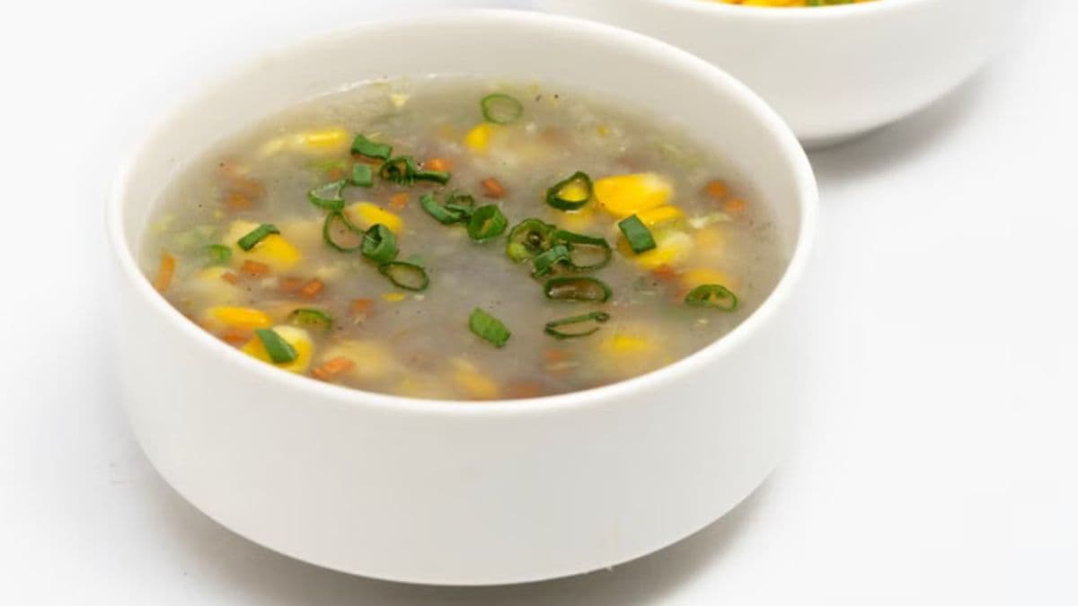 Bowl of sweet corn soup with corn on the side