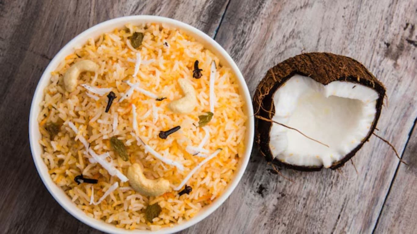 Bowl of coconut rice with cashews and spices