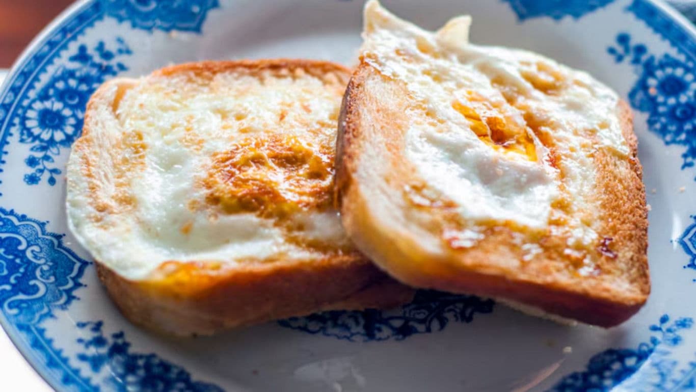 Fried egg toast on patterned plate