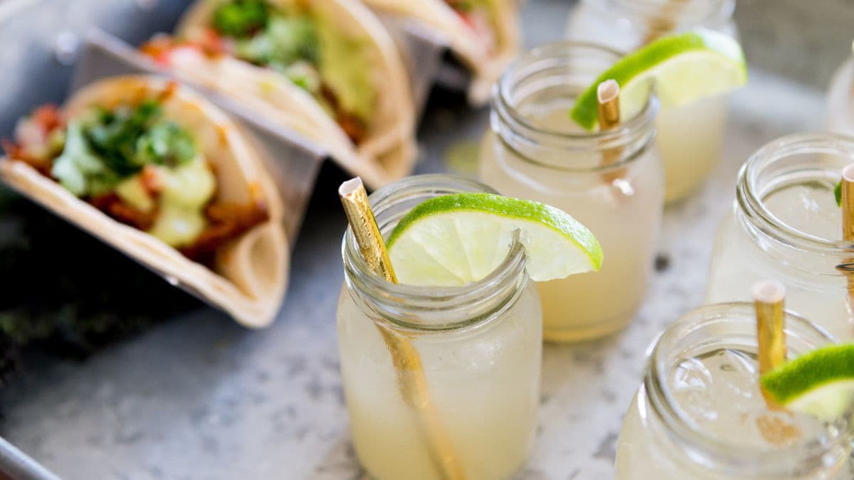A feast with tacos and drinks