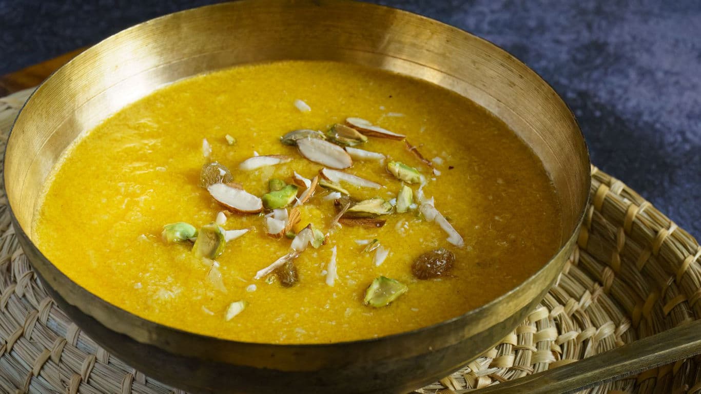 Traditional saffron dessert served in brass bowl