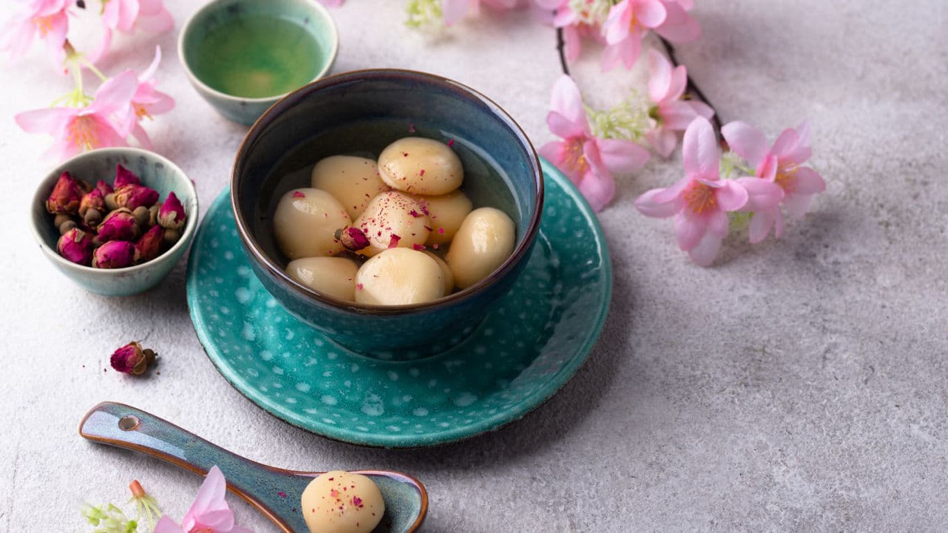 Traditional Sweet Rice Dumplings in Blue Ceramic Bowl