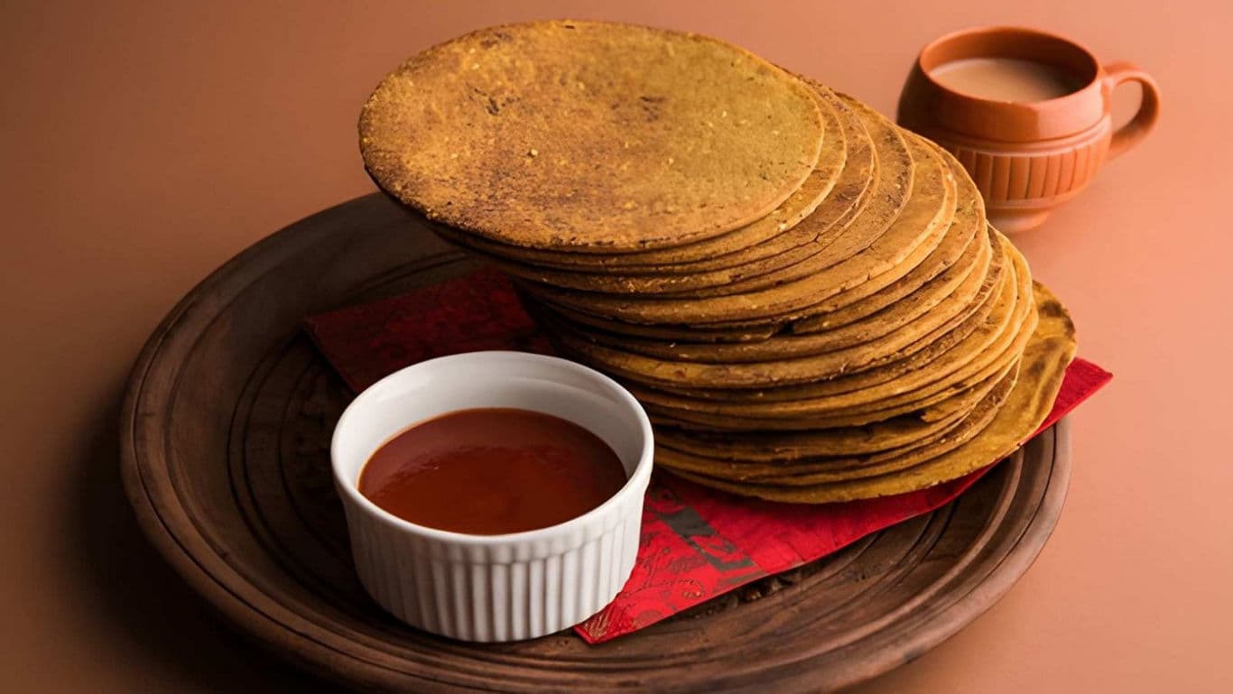 Stack of crispy Indian snacks with chutney