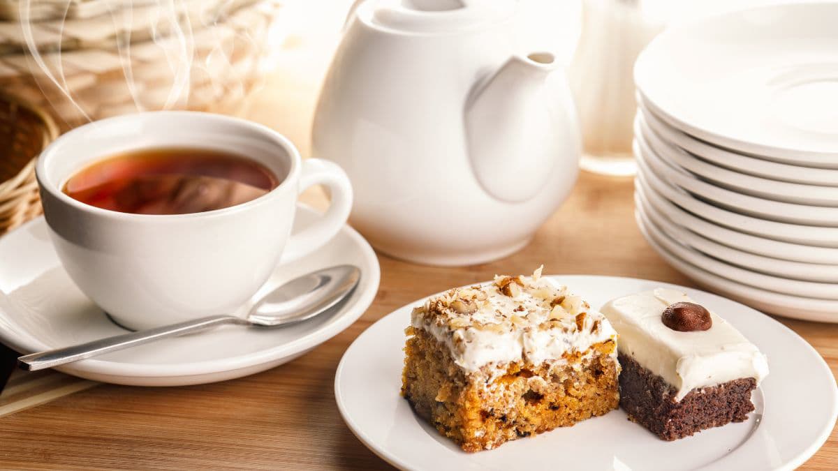 2 tea cake slices with a cup of tea