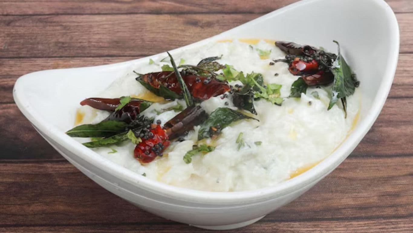 Curd rice with spices in white bowl