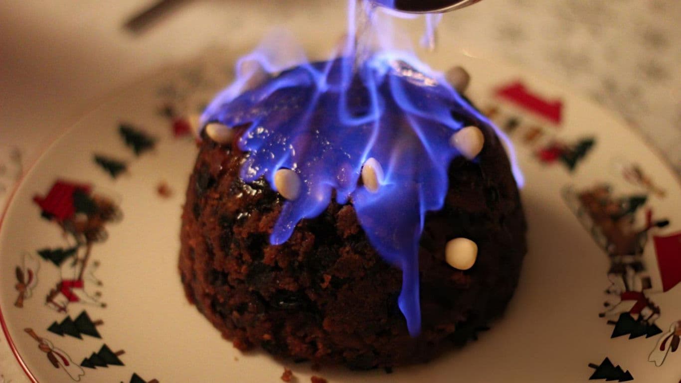 Flaming Christmas Pudding on Festive Plate