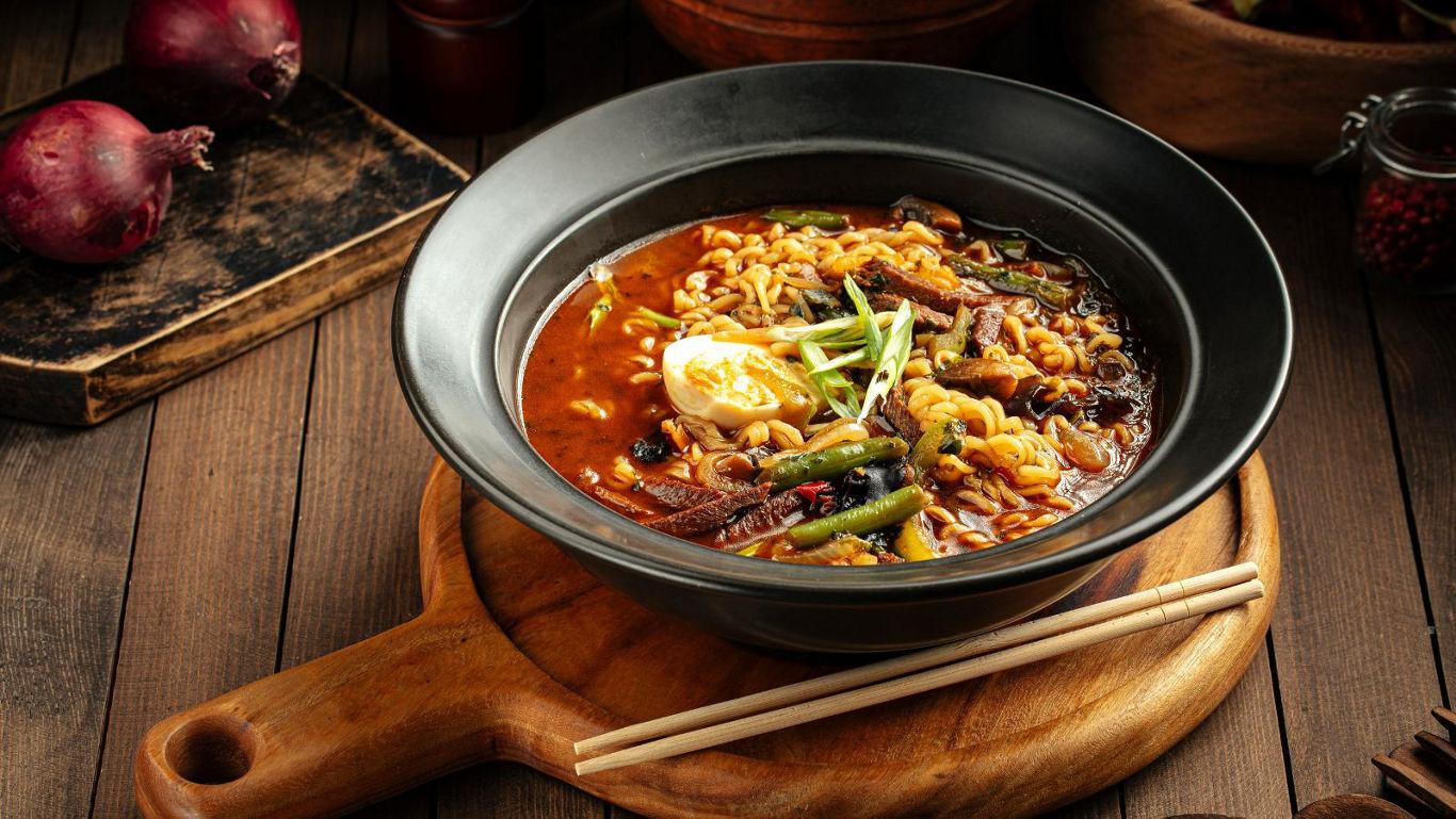 Bowl of spicy ramen with egg garnish