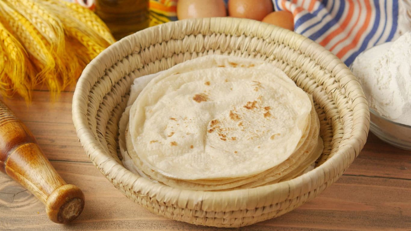 Fresh homemade tortillas in woven basket
