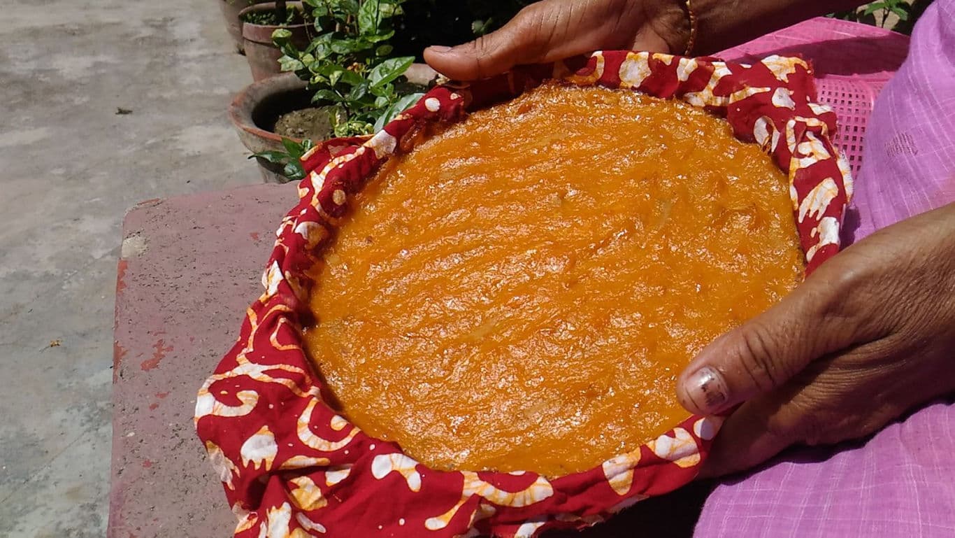 Homemade orange dessert in cloth-lined tray