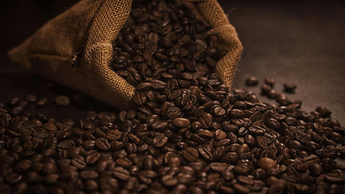 Burlap Sack Spilling Coffee Beans