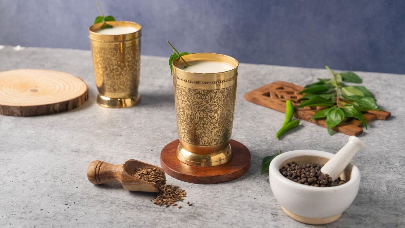 Traditional brass cups with herbal drink
