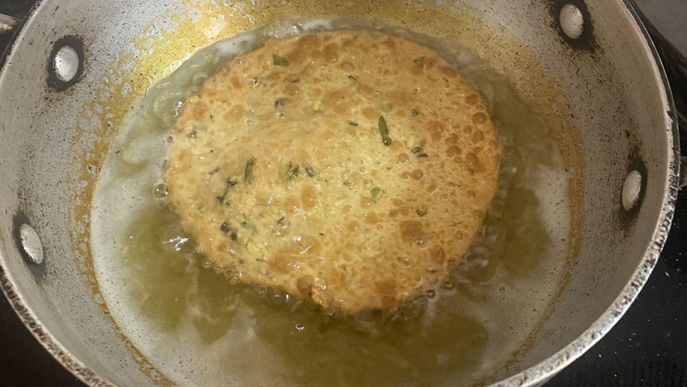 Fluffy golden luchis fried to perfection