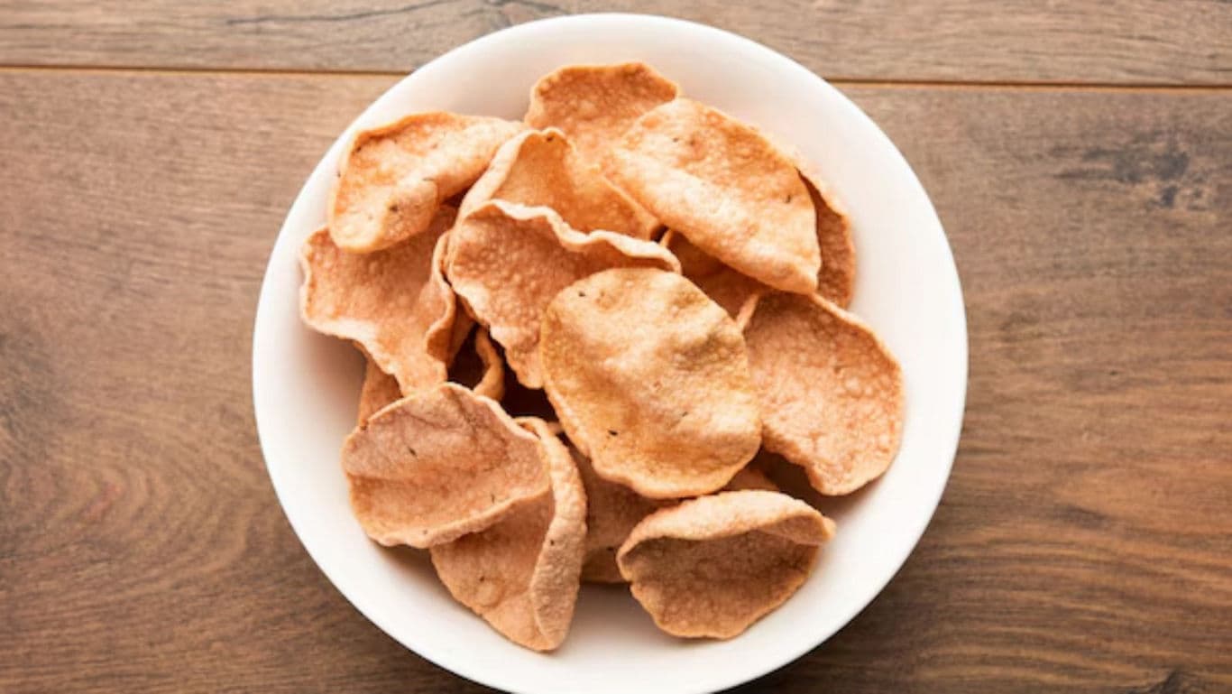 Crispy fried snacks served in white bowl