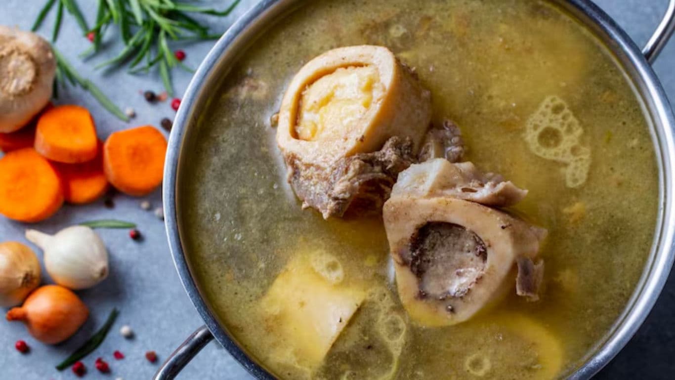 Homemade Bone Broth with Fresh Vegetables in Pot