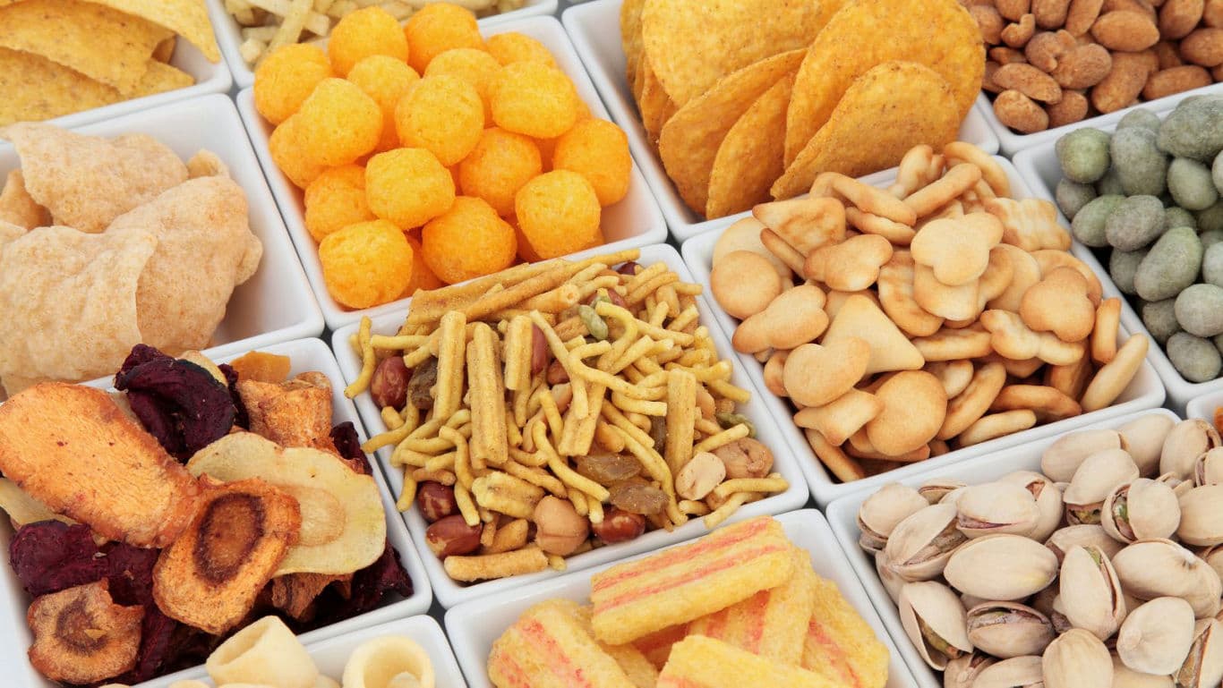 Assorted snack varieties in white trays