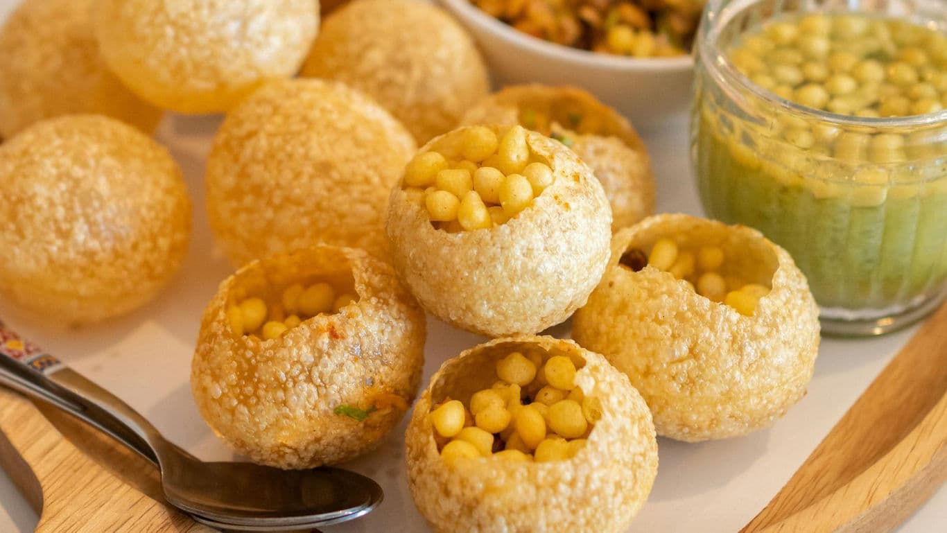 Crispy Indian Pani Puri with Filling and Spiced Water