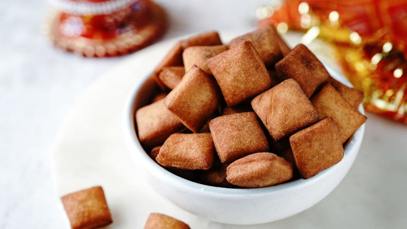 Crispy fried snack bites in white bowl