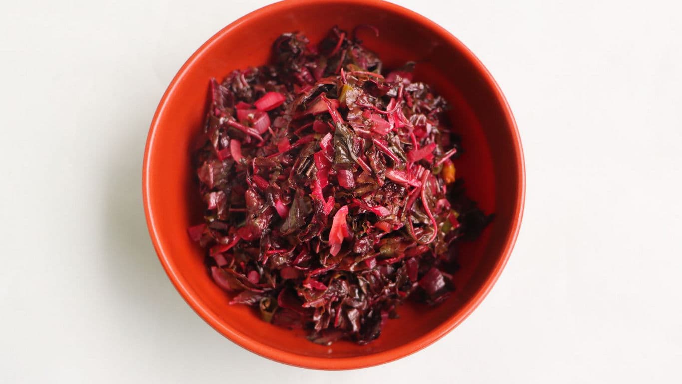 Red cabbage salad in orange bowl
