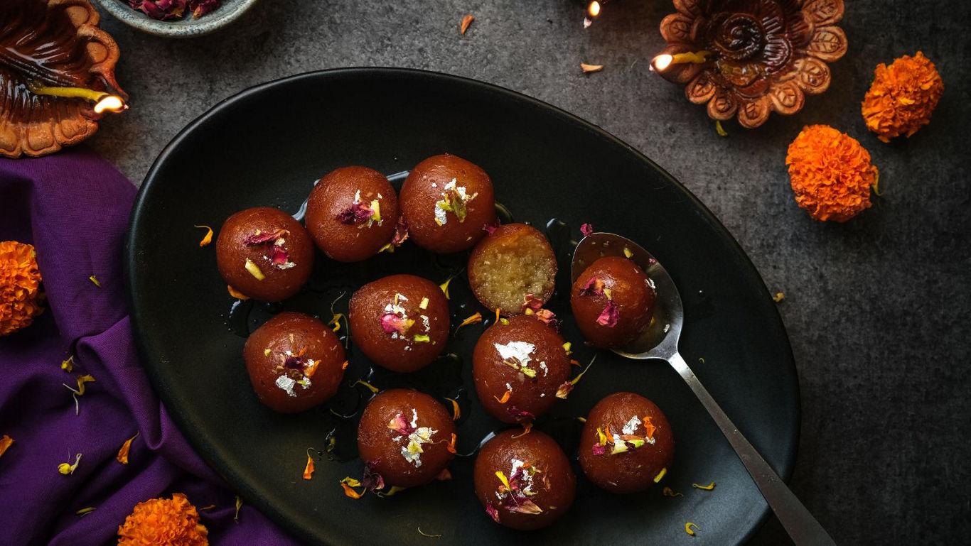 Festive gulab jamun with marigold decor