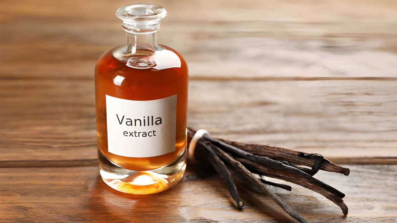 Glass bottle of vanilla extract with vanilla beans