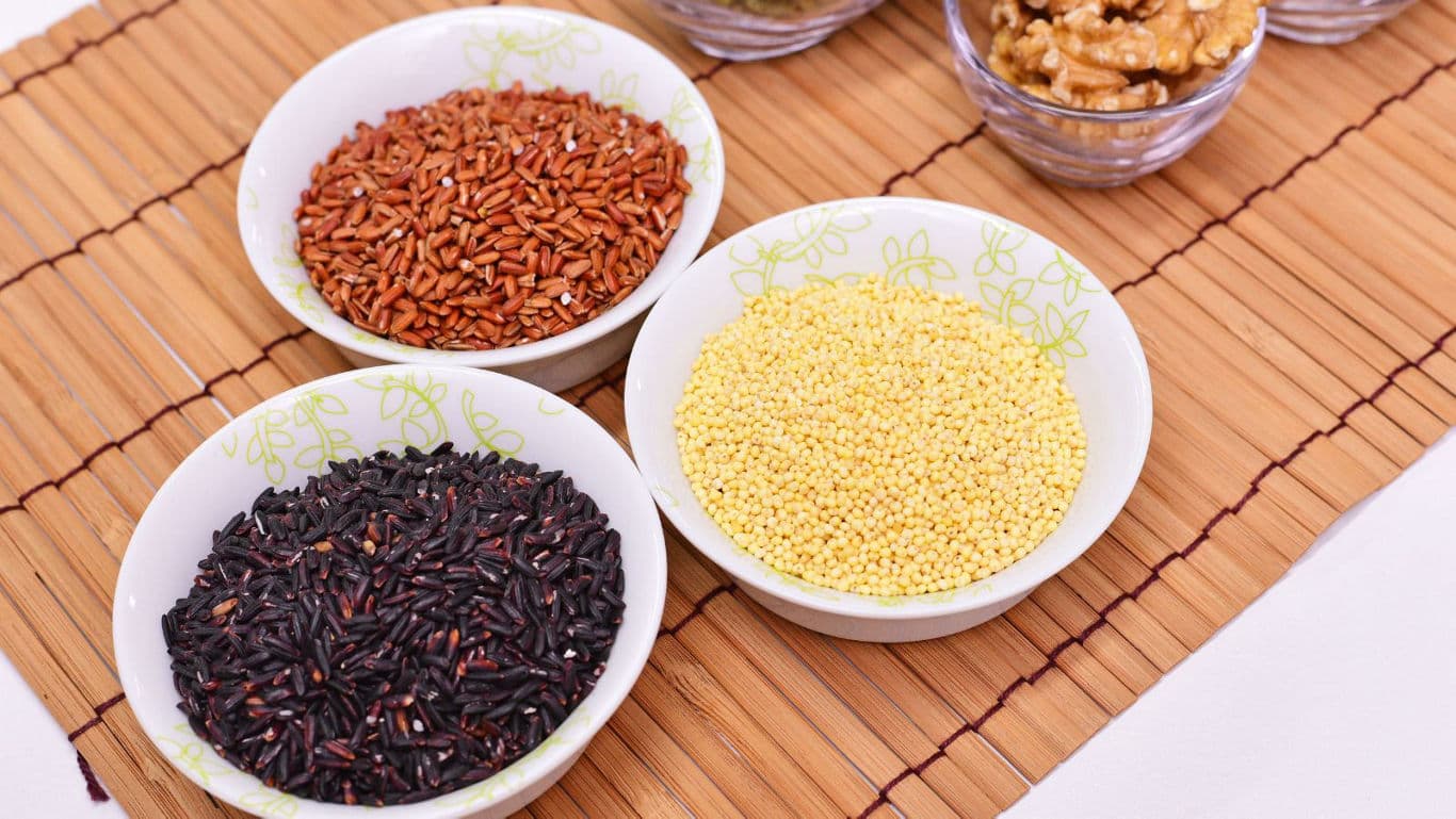 Assorted Grains and Nuts in Ceramic Bowls