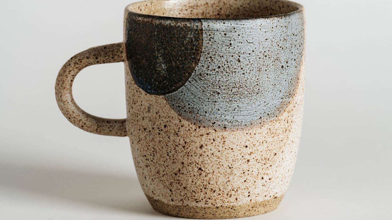 Speckled ceramic mug with abstract glaze