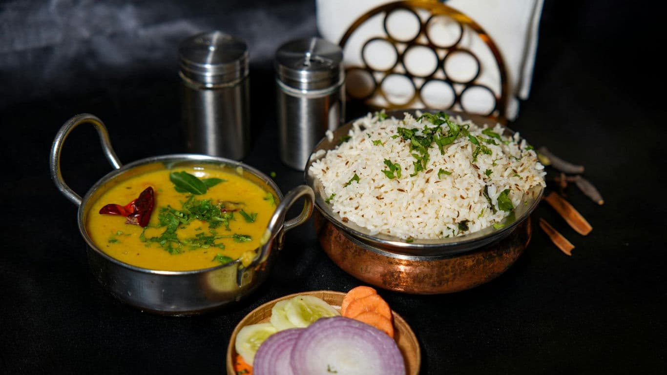 Indian dal curry with rice and salad