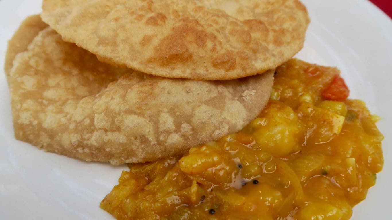 Fried bread with spiced chickpea curry