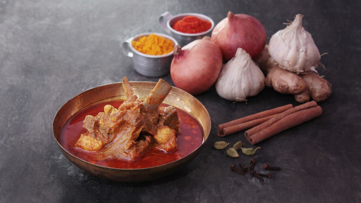 Spicy meat curry with aromatic whole spices