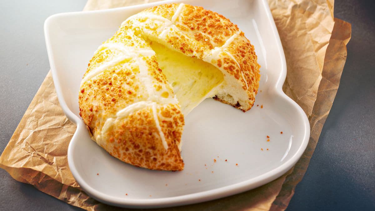 Pull apart bread with cheese string on a plate