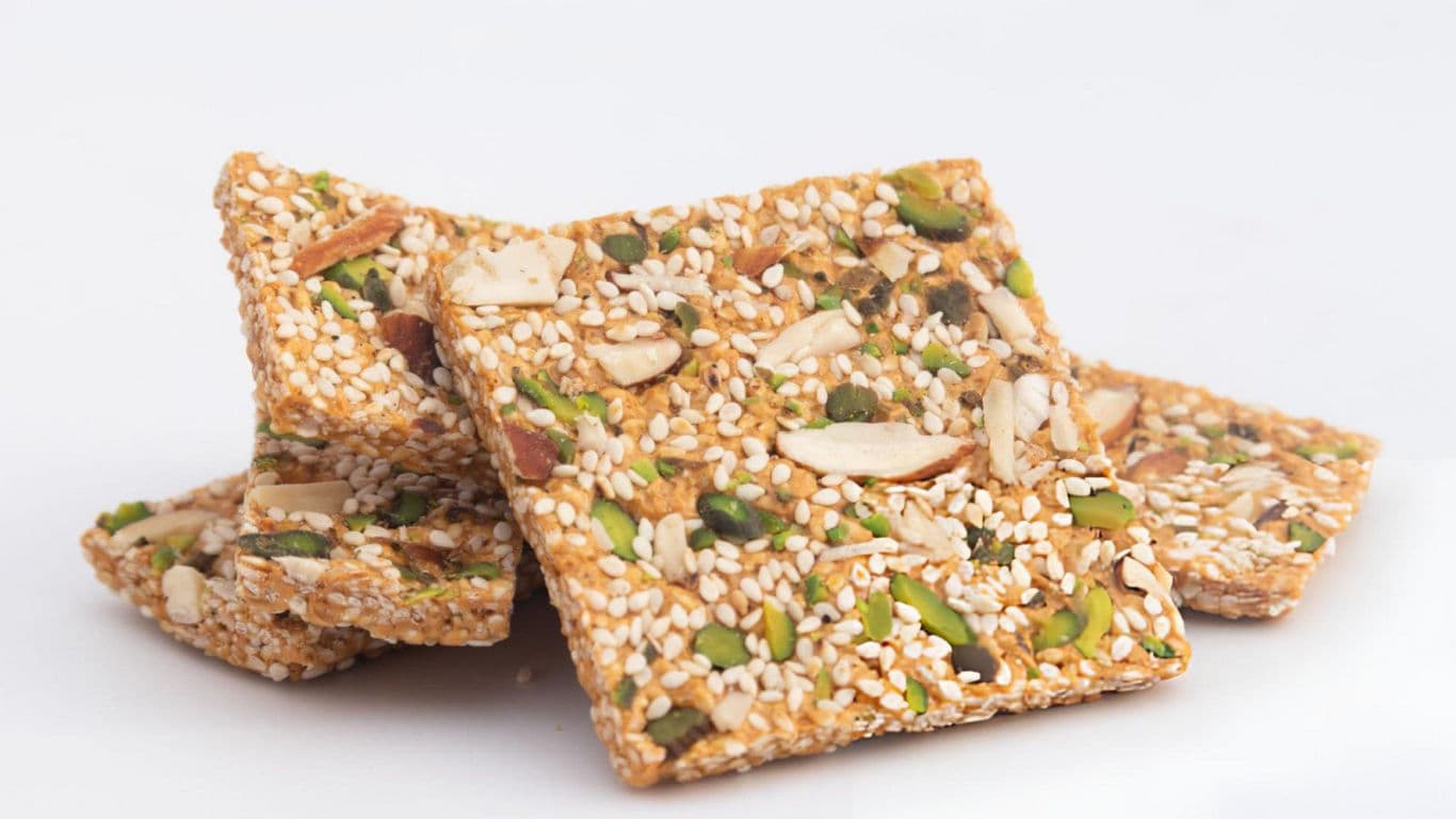 Nut and seed brittle squares on white