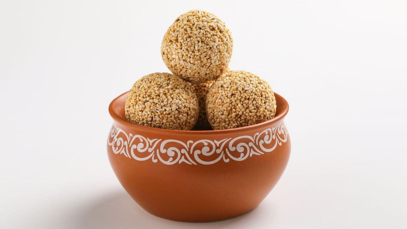 Traditional Indian sweet balls in decorative clay bowl