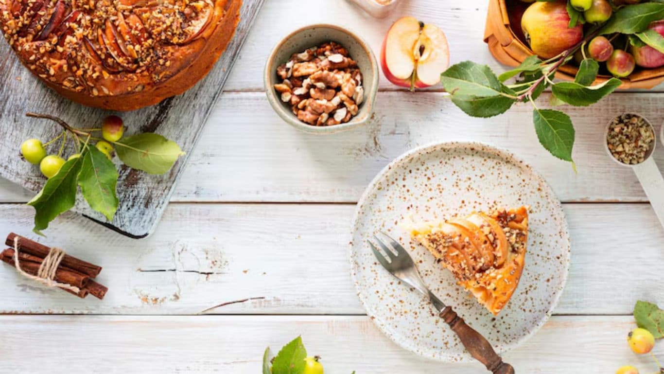 Rustic apple cake slice with walnuts and cinnamon