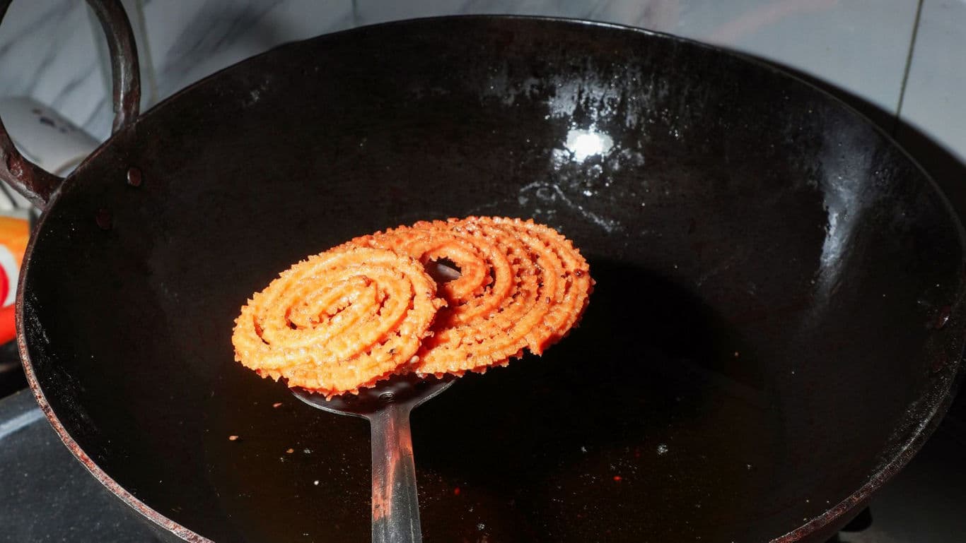 Freshly fried spiral snack in wok